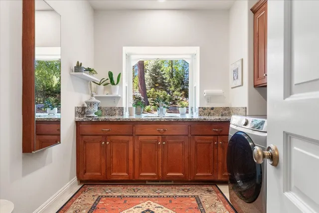a bathroom with a sink vanity and toilet