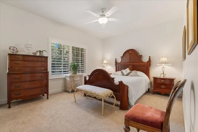 a view of a livingroom with furniture and a hallway