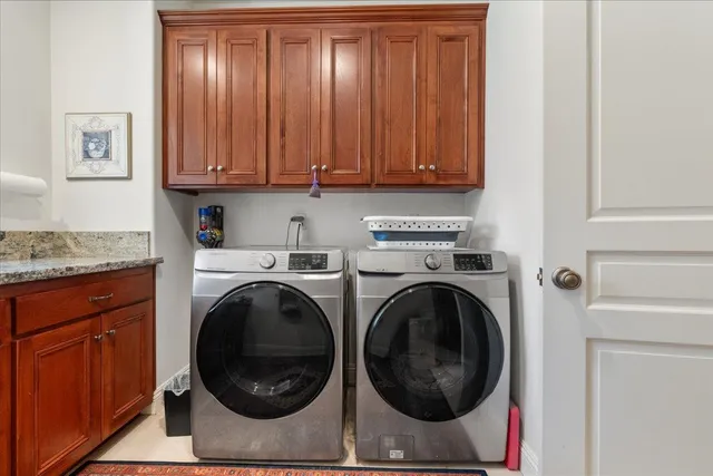 a wooden bench sitting in the middle of a yard