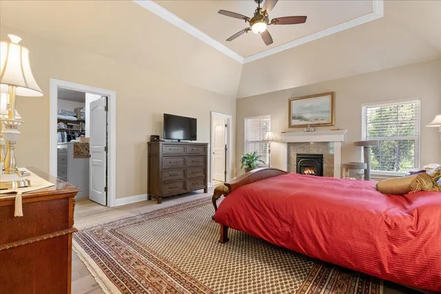 a front view of a house with a yard and fountain in middle