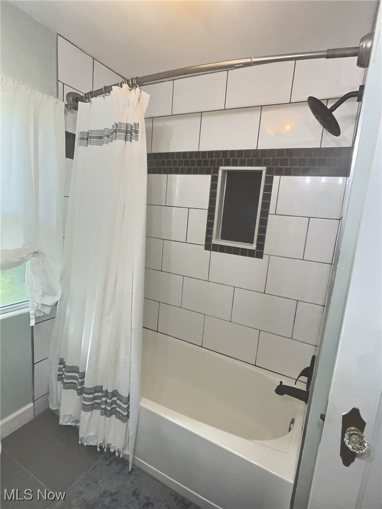 3688 Easton Road Norton, OH 44203 - Photo 35 of 37 Bathroom with shower / tub combo and tile patterned flooring