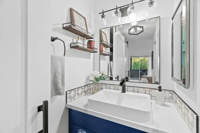 a bathroom with a sink and a mirror