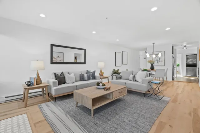 a living room with furniture and a rug