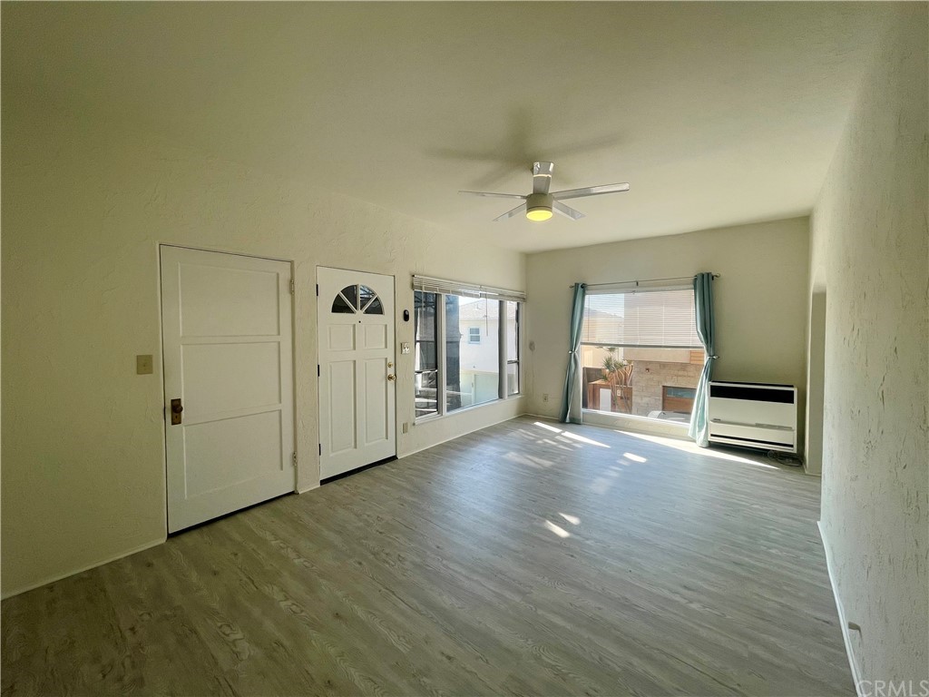 2802 Ocean Drive Manhattan Beach, CA 90266 - Photo 4 of 22 a view of an empty room with window and wooden floor