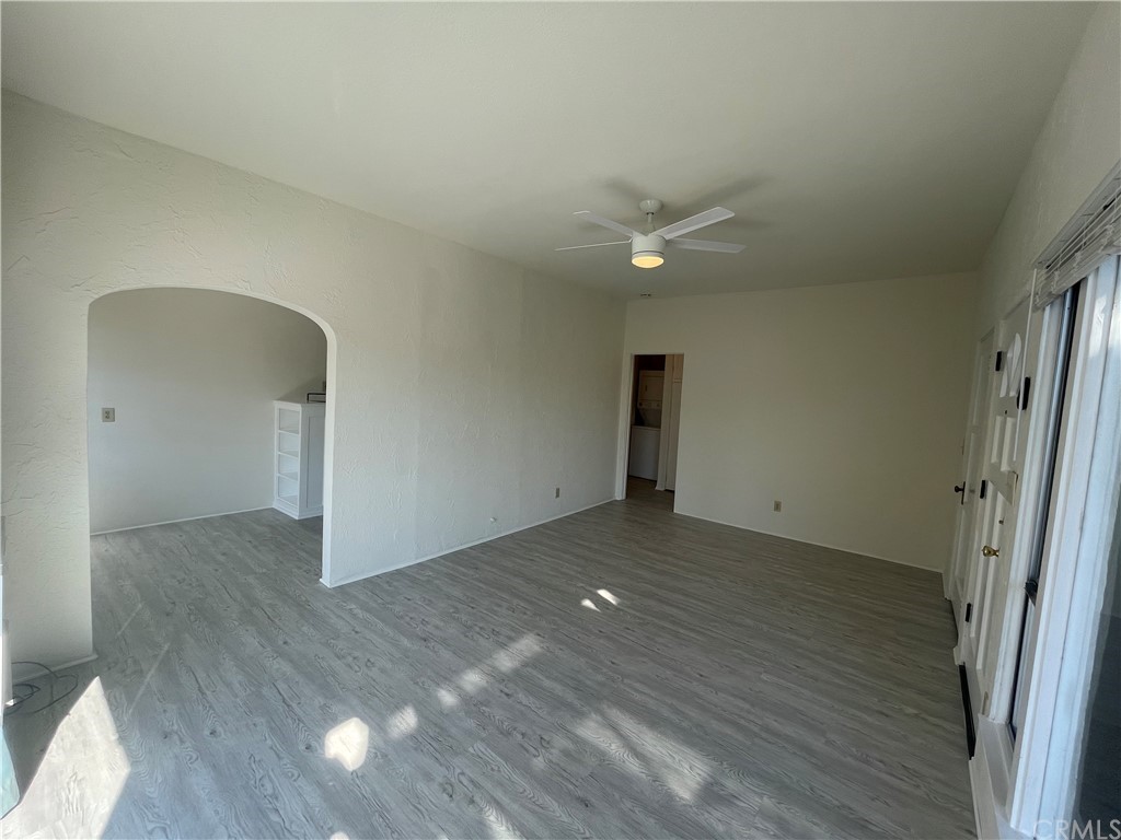 2802 Ocean Drive Manhattan Beach, CA 90266 - Photo 7 of 22 an empty room with wooden floor and a ceiling fan