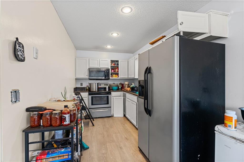 115 Cash Way Rockmart, GA 30153 - Photo 15 of 35 a kitchen with stainless steel appliances a refrigerator stove and a sink