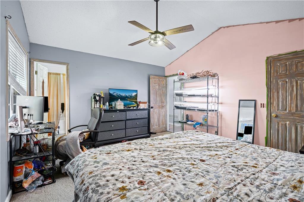 115 Cash Way Rockmart, GA 30153 - Photo 19 of 35 a bedroom with a bed dresser and a large window