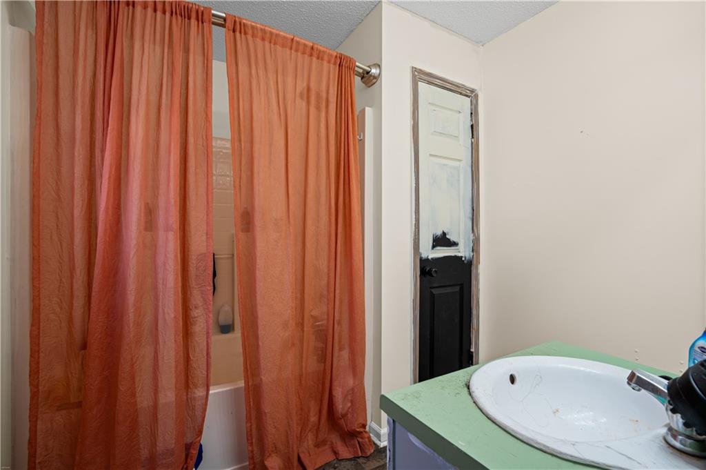 115 Cash Way Rockmart, GA 30153 - Photo 22 of 35 a bathroom with a sink and a mirror