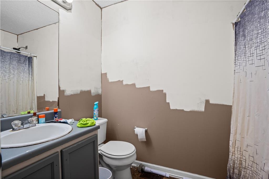 115 Cash Way Rockmart, GA 30153 - Photo 25 of 35 a bathroom with a sink mirror vanity and toilet