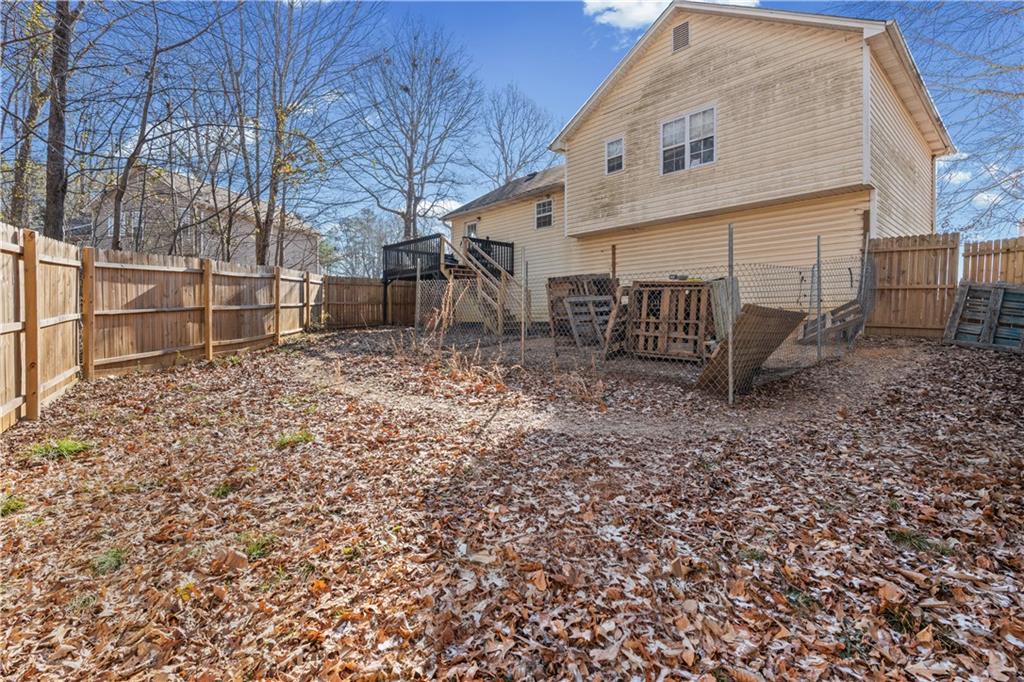 115 Cash Way Rockmart, GA 30153 - Photo 30 of 35 a view of a backyard with plants and wooden fence