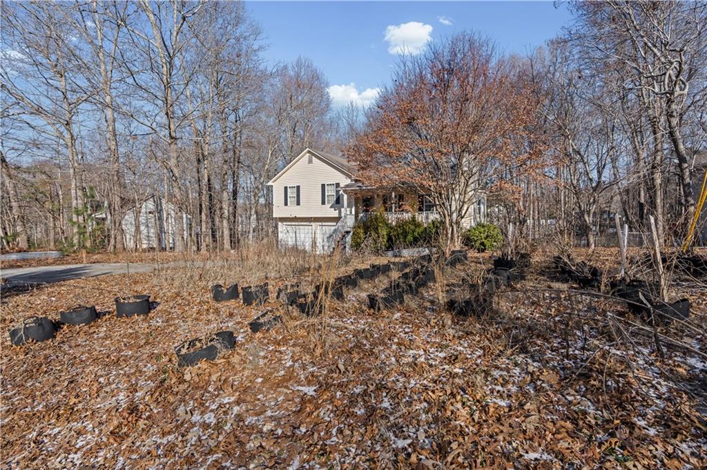 115 Cash Way Rockmart, GA 30153 - Photo 3 of 35 a view of a house with a yard and trees