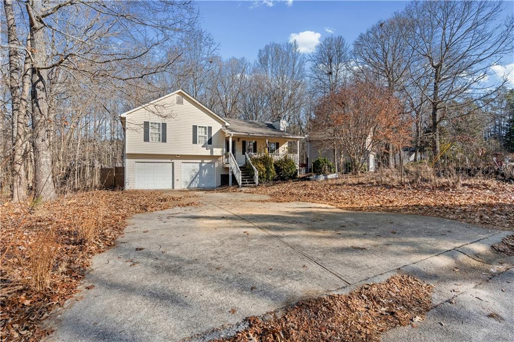 115 Cash Way Rockmart, GA 30153 - Photo 5 of 35 a view of a white house with a snow on the road