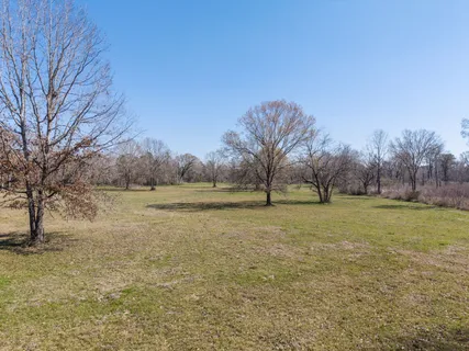a view of lake with a yard