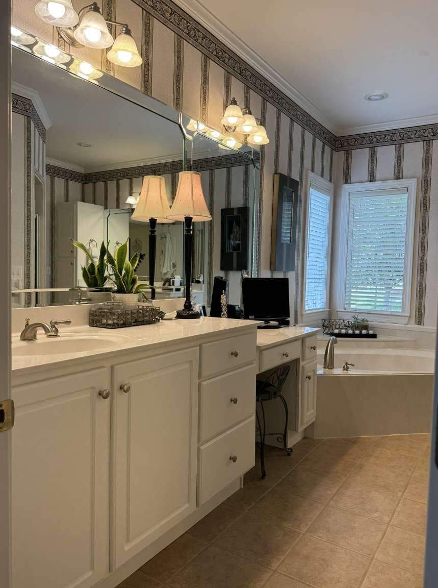 513 Owen Road Leeds, AL 35094 - Photo 14 of 25 a bathroom with a granite countertop sink mirror and a bathtub