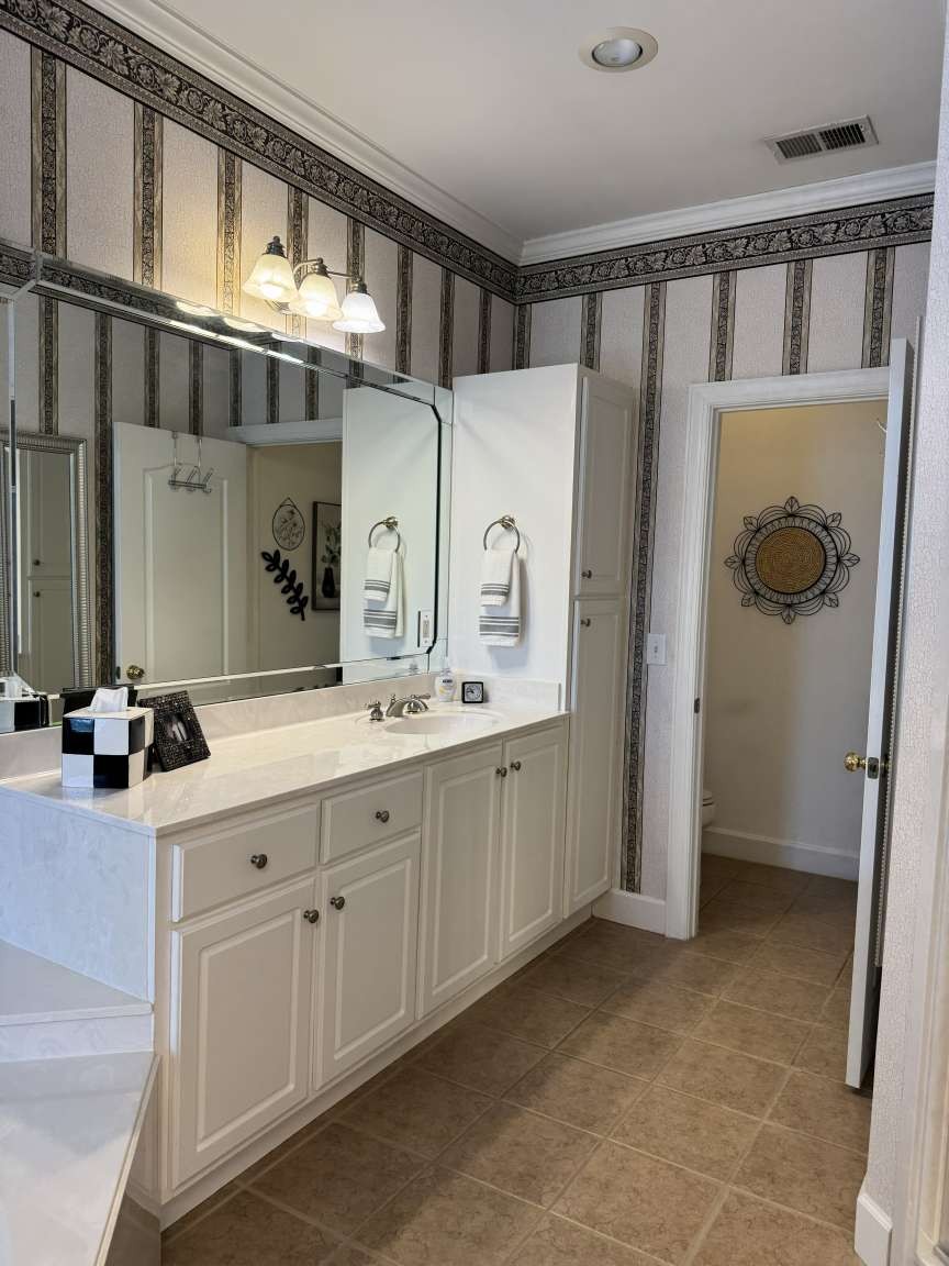 513 Owen Road Leeds, AL 35094 - Photo 15 of 25 a bathroom with double vanity and a mirror