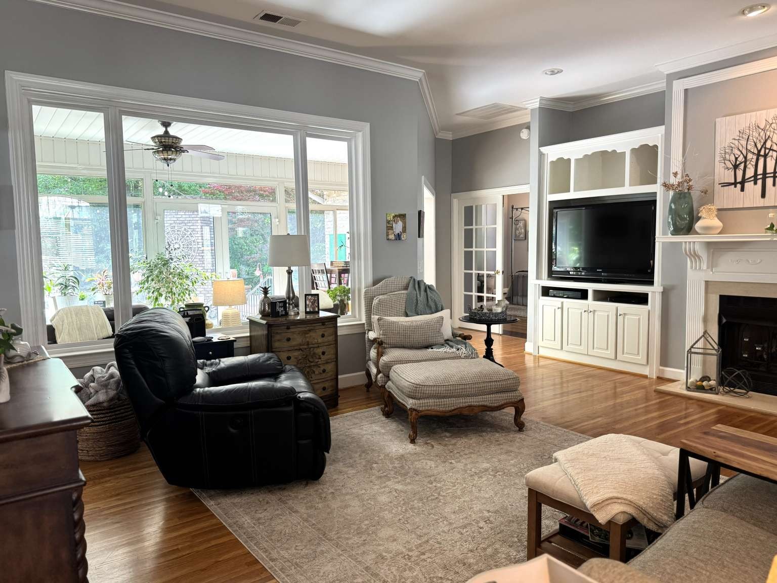 513 Owen Road Leeds, AL 35094 - Photo 4 of 25 a living room with fireplace furniture and a flat screen tv