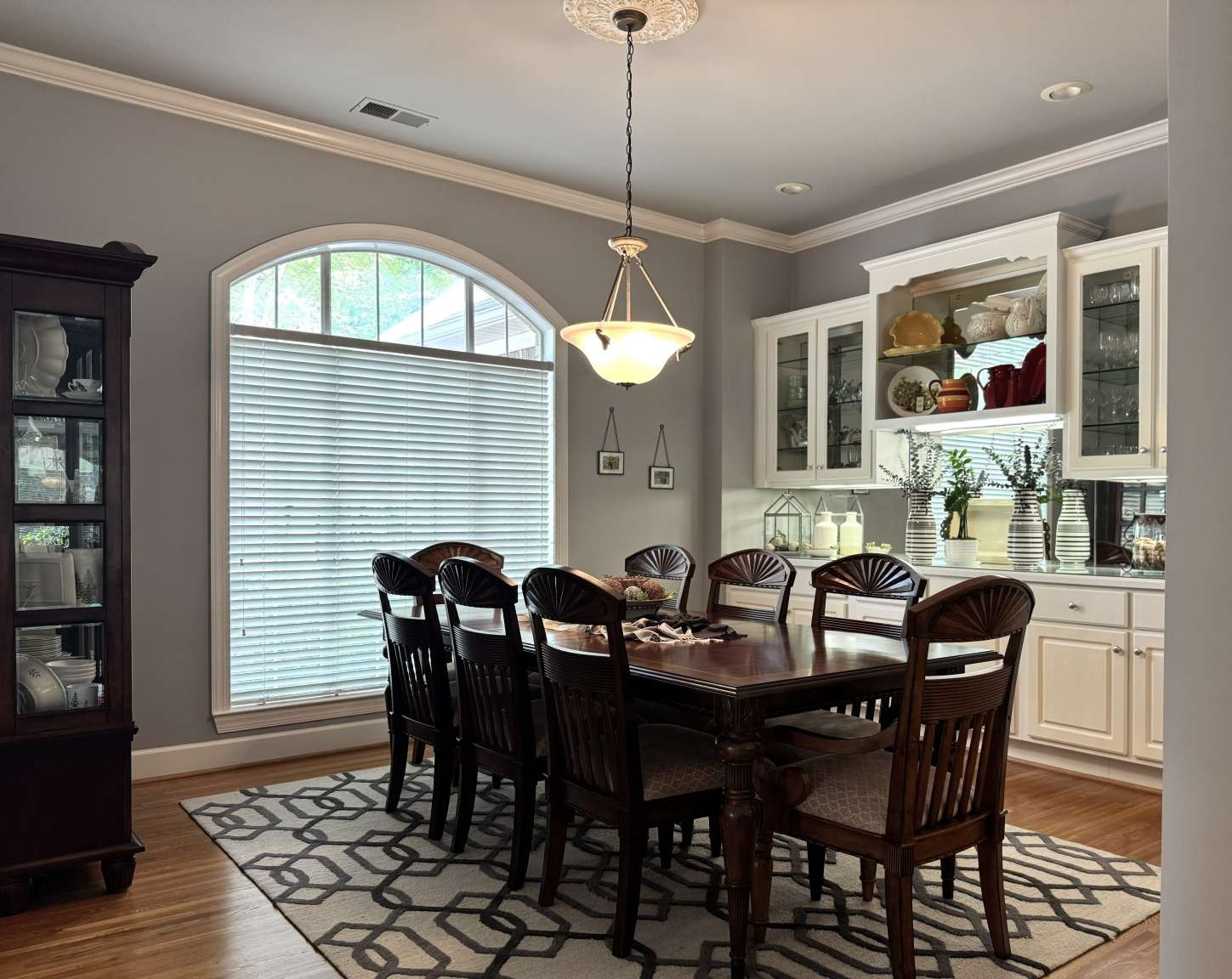 513 Owen Road Leeds, AL 35094 - Photo 6 of 25 a dining room with furniture a chandelier and wooden floor