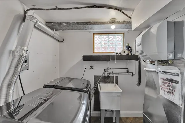 a kitchen with a sink appliances and a window