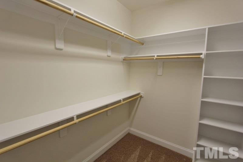 201 Virginia Water Drive Rolesville, NC 27571 - Photo 13 of 25 a view of an empty walk in closet