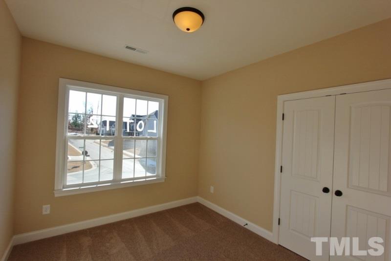 201 Virginia Water Drive Rolesville, NC 27571 - Photo 17 of 25 a view of a livingroom with a window