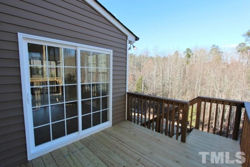 201 Virginia Water Drive Rolesville, NC 27571 - Photo 22 of 25 a view of wooden balcony