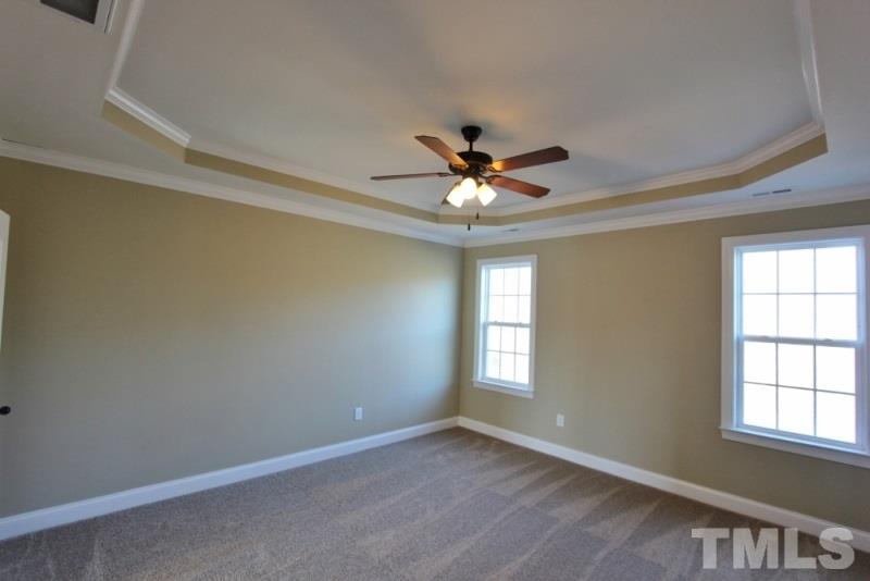 201 Virginia Water Drive Rolesville, NC 27571 - Photo 9 of 25 an empty room with window and ceiling fan