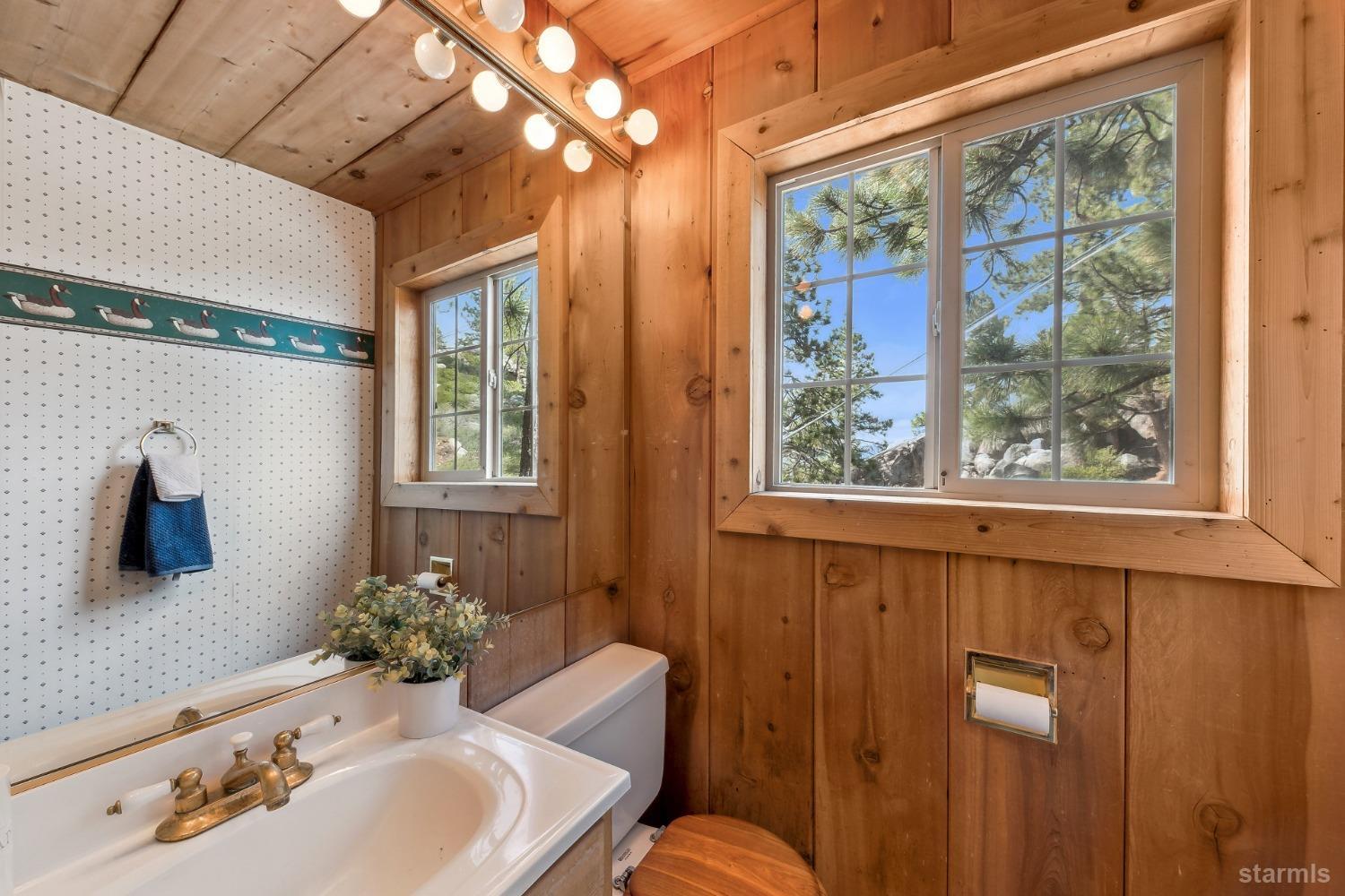 631 Point Road Zephyr Cove, NV 89448 - Photo 22 of 28 a bathroom with a sink and a mirror