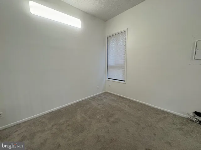 an empty room with a empty space and window