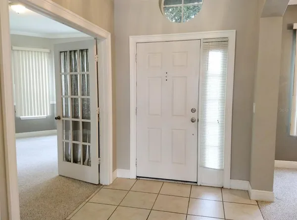 a view of an empty room with a window