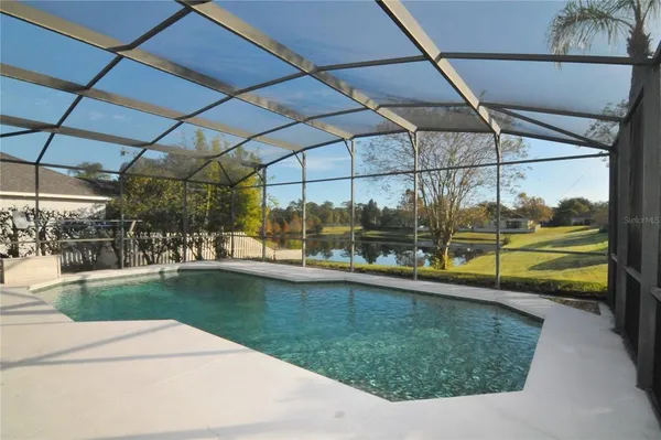 a view of a swimming pool with a porch