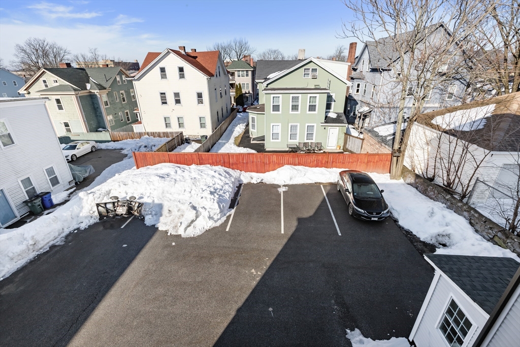 222 Rock Street, Unit 2 Fall River, MA 02720 - Photo 19 of 21 a view of a house with a yard