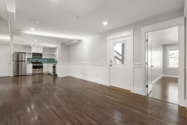 a view of a kitchen with a sink and a stove top oven