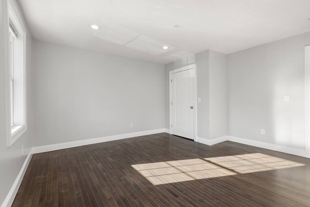 222 Rock Street, Unit 2 Fall River, MA 02720 - Photo 10 of 21 a view of an empty room with wooden floor