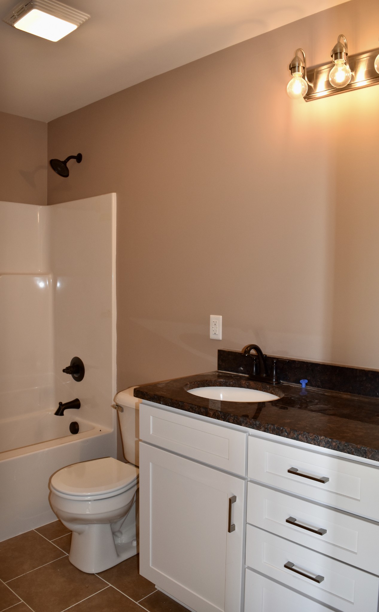 151 East Carter Road Portland, TN 37148 - Photo 10 of 14 a bathroom with a granite countertop sink a toilet and a mirror