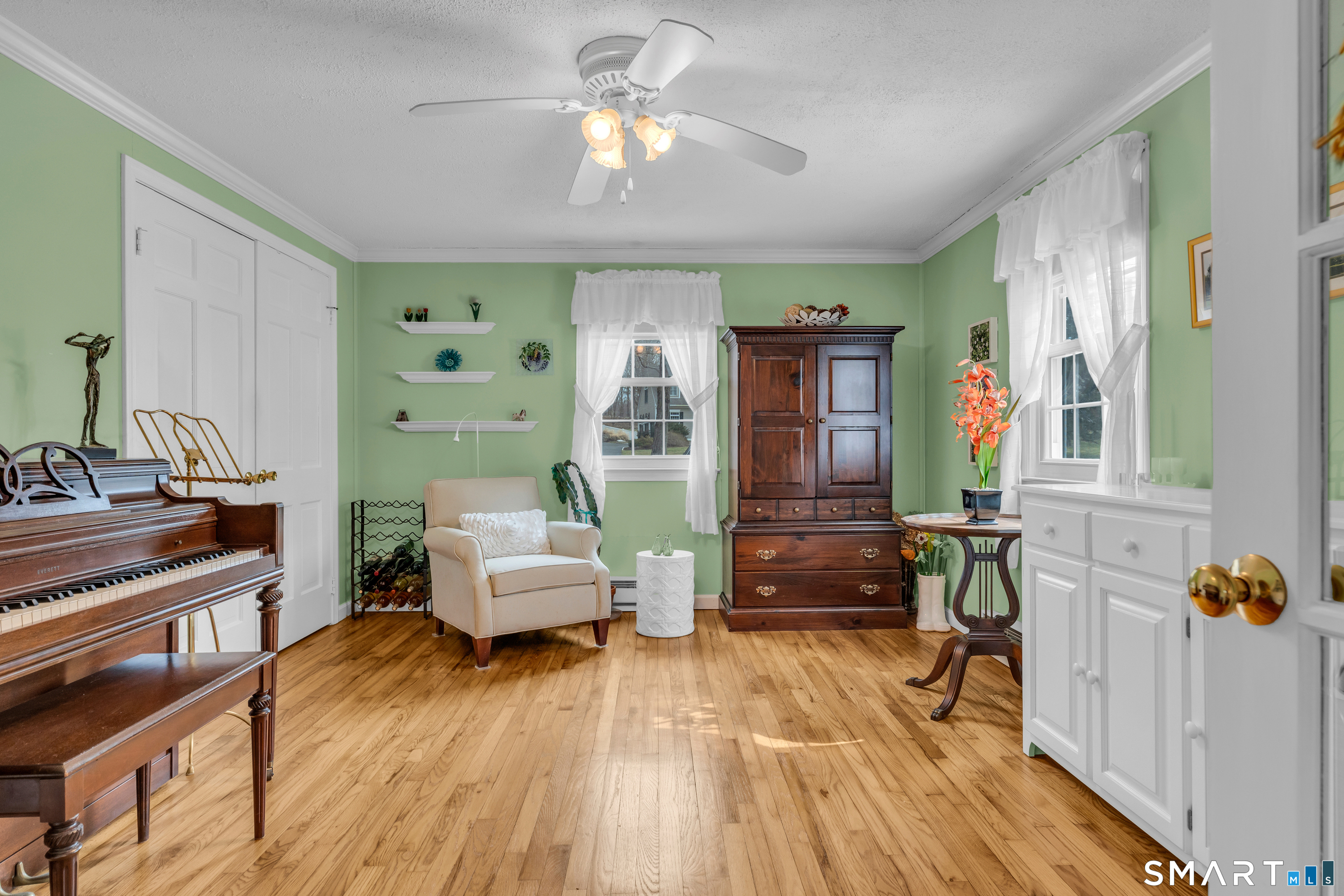 110 Nut Plains Road Guilford, CT 06437 - Photo 22 of 40 The second first floor bedroom, currently living its best life as a music room.