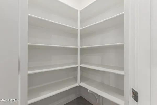 a view of an empty walk in closet