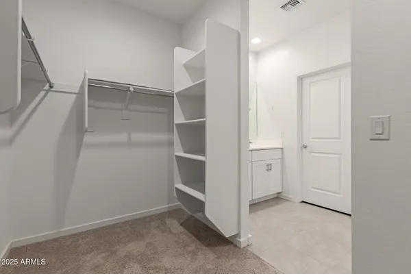 a view of an empty walk in closet