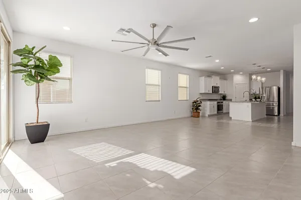 a view of an and dining room with wooden floor and a potted plant