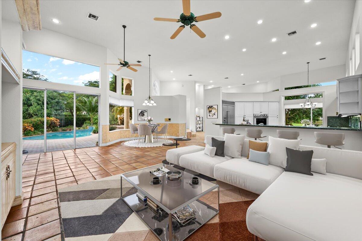 3241 Northwest 63rd Street Boca Raton, FL 33496 - Photo 27 of 75 a living room with furniture and a large window