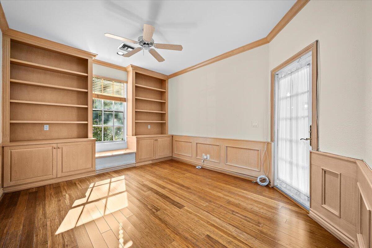3241 Northwest 63rd Street Boca Raton, FL 33496 - Photo 43 of 75 a view of an empty room with a window and wooden floor