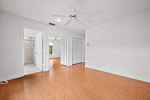 a view of sign board with flower plants