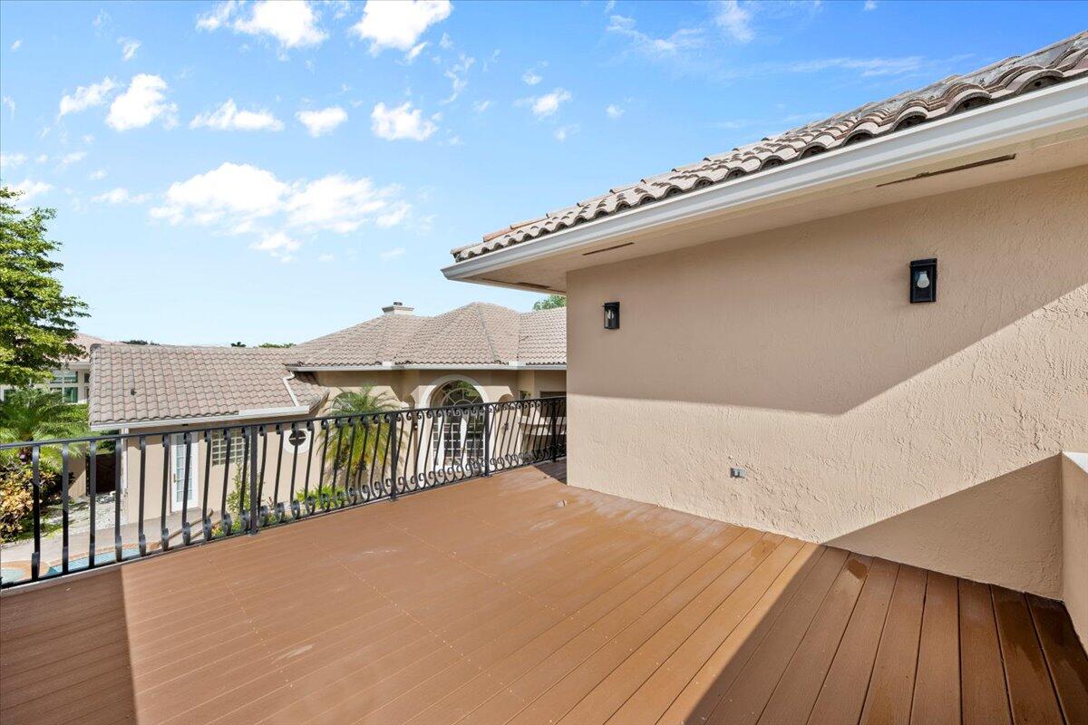 3241 Northwest 63rd Street Boca Raton, FL 33496 - Photo 54 of 75 a view of a terrace with a backyard