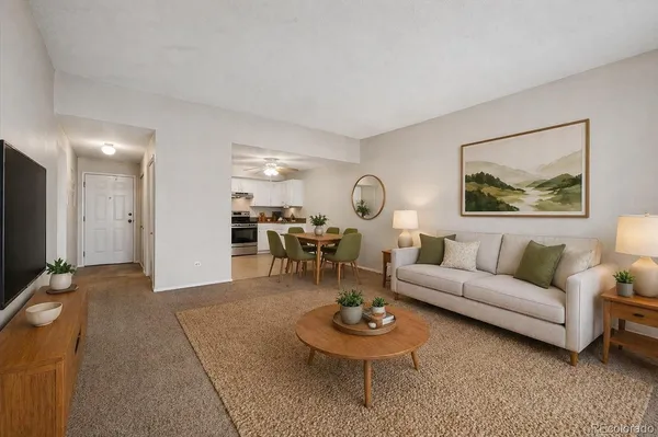 a living room with furniture and a breakfast area