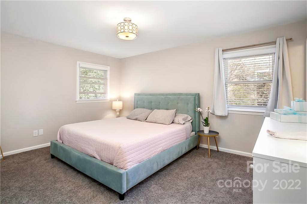 6009 Pepperhill Road Charlotte, NC 28212 - Photo 13 of 17 a bed sitting in a bedroom next to a window