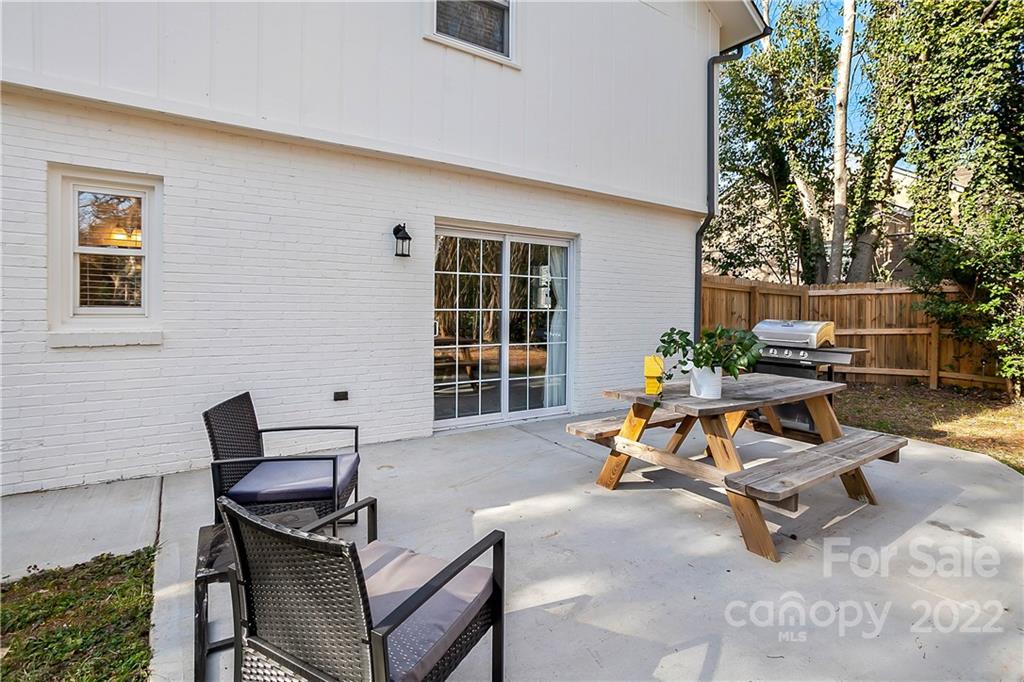 6009 Pepperhill Road Charlotte, NC 28212 - Photo 15 of 17 a view of a patio with table and chairs with a yard