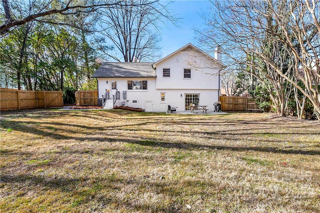 6009 Pepperhill Road Charlotte, NC 28212 - Photo 17 of 17 a view of a white house with a large tree in front of it