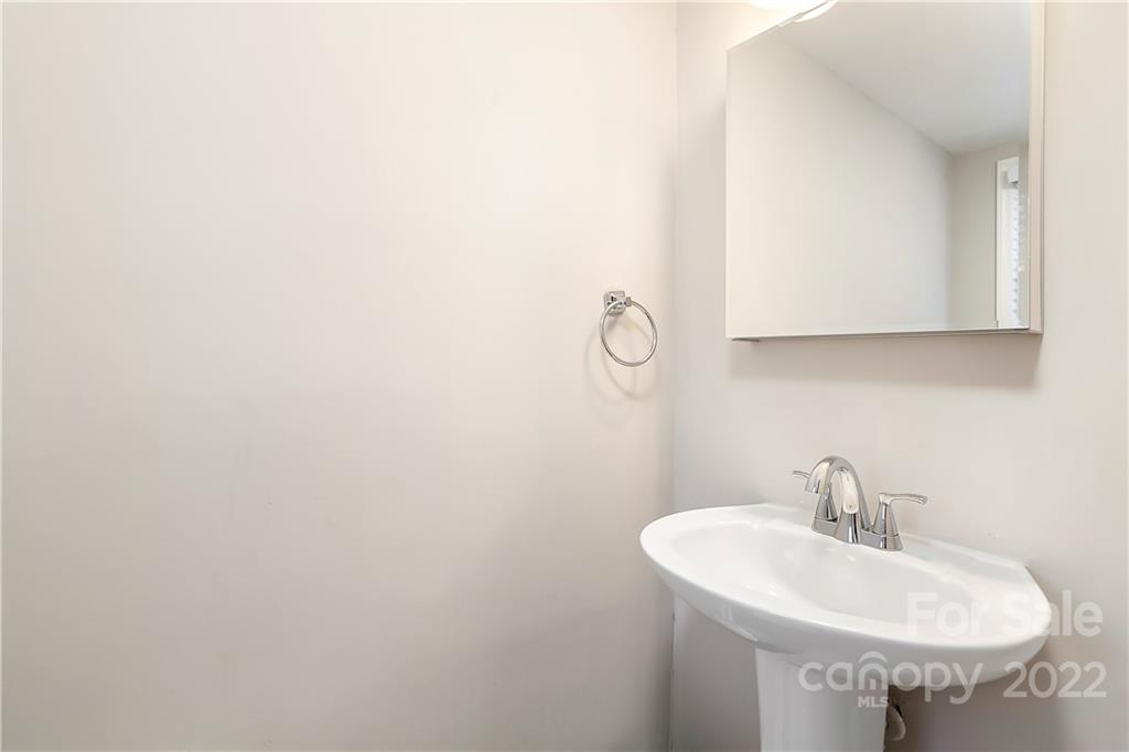 6009 Pepperhill Road Charlotte, NC 28212 - Photo 9 of 17 a sink with a mirror