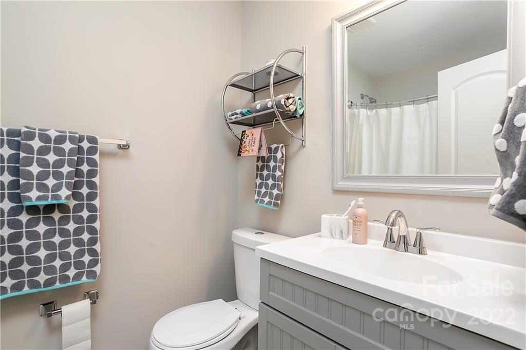 6009 Pepperhill Road Charlotte, NC 28212 - Photo 10 of 17 a bathroom with a sink a toilet and shower