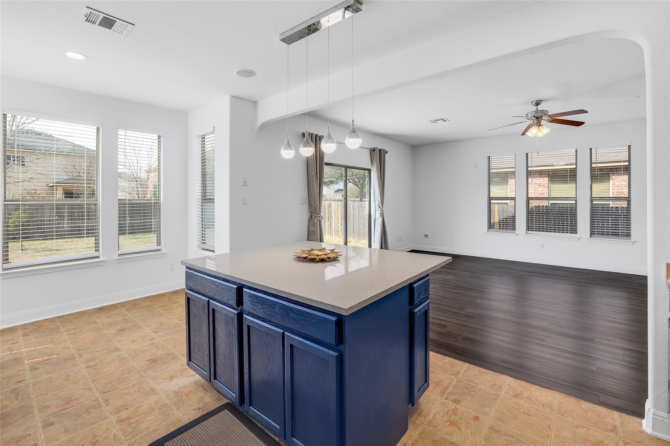 203 Ran Road Leander, TX 78641 - Photo 31 of 31 An open floorplan seamlessly connects the kitchen island to a spacious living area.