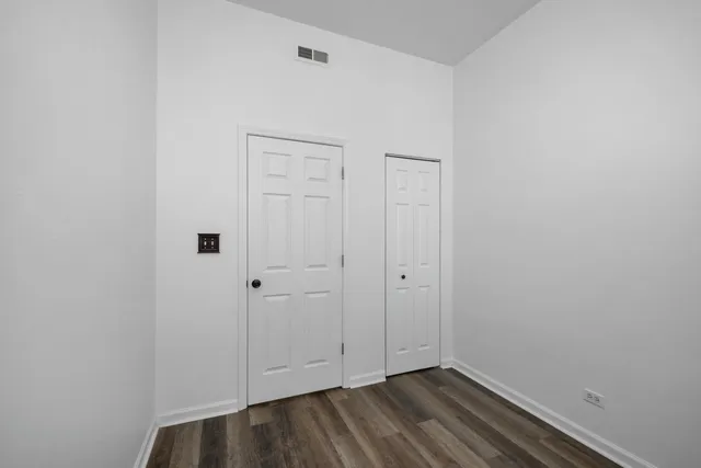 a view of room with hardwood floor